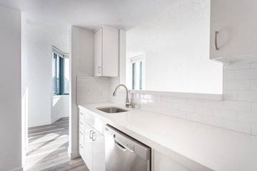 San Francisco apartment for rent - a white kitchen with a sink and a dishwasher