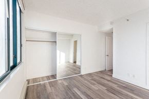 San Francisco apartment for rent - a bedroom with white walls and a large window