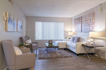 Mesa apartment for rent - a living room with couches and chairs and a table