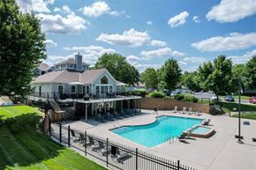 Kansas City apartment for rent - A large house with a pool in the backyard.