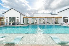 Georgetown apartment for rent - A white house with a pool in front.