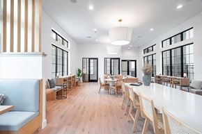 Georgetown apartment for rent - A modern dining room with wooden floors and furniture.