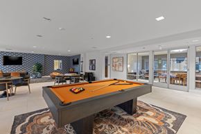 Milton townhouse for rent - A pool table is in the middle of a room with a patterned carpet.