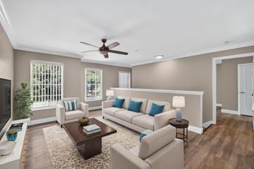 Naples apartment for rent - A living room with a white couch and a brown coffee table.