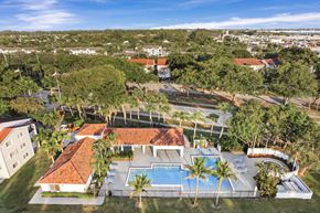 West Palm Beach apartment for rent - A large clubhouse with a pool in the backyard.