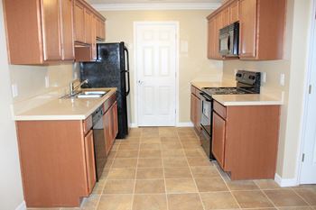 Kitchen with refrigerator oven dishwasher 