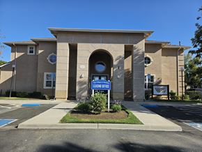 Mendota apartment for rent - A building with a sign that says "Leasing Office".