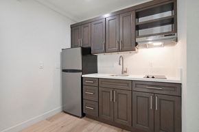 Citrus Heights apartment for rent - a kitchen with dark cabinets and white countertops at Citrus Heights Apartments, Citrus Heights, CA