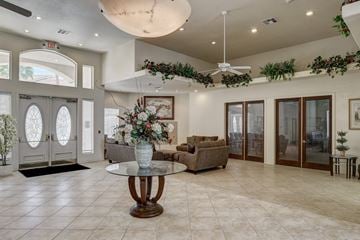 Henderson apartment for rent - A living room with a glass table and a couch.