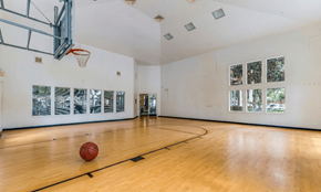 Sanford apartment for rent - A basketball is on the court in an empty gym.