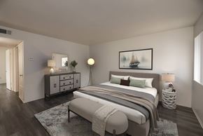 Antioch apartment for rent - A bedroom with a bed, nightstands, and a painting on the wall.