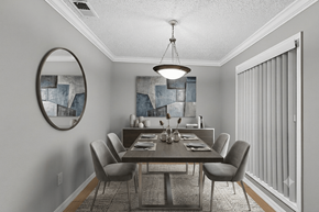 Oldsmar apartment for rent - A dining room with a table set for six.