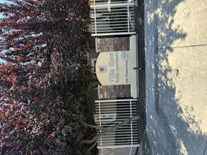 Selma apartment for rent - A sign on a pole in front of a tree.