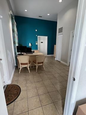 Key West apartment for rent - A room with a blue wall and a white door.