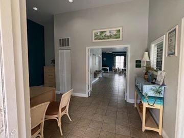 Key West apartment for rent - A living room with a dining table and chairs.