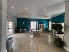 Key West apartment for rent - A spacious room with a dining table and chairs.