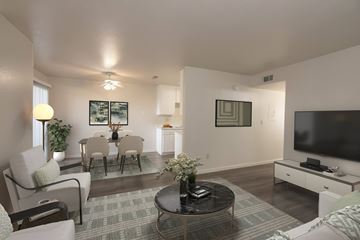 Antioch apartment for rent - A living room with a grey carpet and a black coffee table.