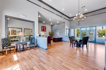 Las Vegas apartment for rent - a living room and dining room with a table and chairs