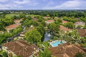 Sanford apartment for rent - A bird's eye view of a resort with a pool and a fountain.