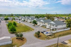 Panama City townhouse for rent - A residential area with houses and a parking lot.