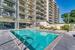 National City apartment for rent - a swimming pool in front of an apartment building