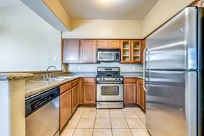 Las Vegas condo for rent - an updated kitchen with stainless steel appliances and granite counter tops
