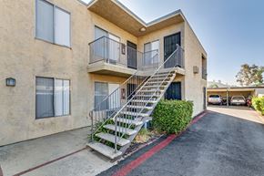 Lakeside apartment for rent - A building with a staircase leading to the second floor.