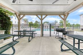 Panama City apartment for rent - A covered picnic area with tables and benches.