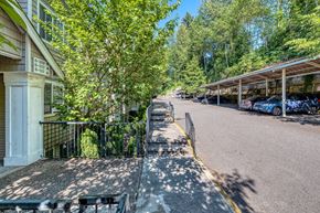 Seattle apartment for rent - entrance to property with parking lot spaces nearby