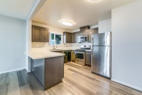 Chula Vista apartment for rent - A kitchen with a refrigerator, oven, and microwave.