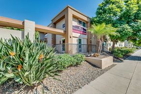 Chula Vista apartment for rent - A building with a sign that says Woodland Leasing Center.