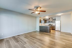 Chula Vista apartment for rent - A room with a ceiling fan and wooden flooring.