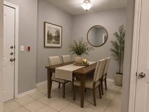 Dallas apartment for rent - A dining room with a wooden table and chairs.