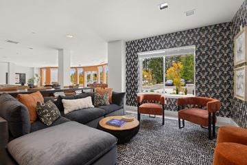 Milton townhouse for rent - A living room with a grey couch and a coffee table.