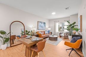 Milton townhouse for rent - A modern dining room with a wooden table and chairs.