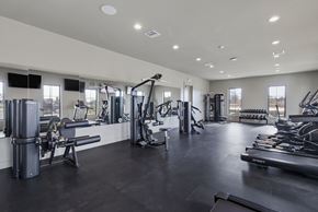 Tallahassee townhouse for rent - A spacious gym with various exercise equipment.