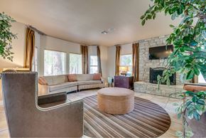Las Vegas apartment for rent - A living room with a fireplace and a couch.