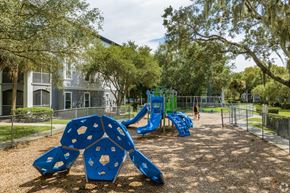 Riverview apartment for rent - A playground with a blue slide and a climbing frame.