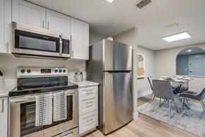 Holly Hill apartment for rent - a kitchen with white cabinets and stainless steel appliances