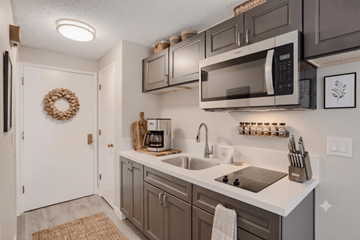 Portland apartment for rent - A kitchen with a white counter top and a white sink.