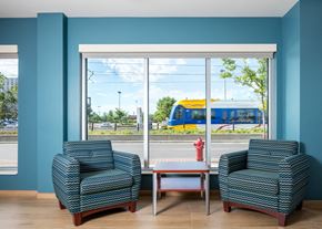 Saint Paul apartment for rent - a waiting room with two chairs and a window with a train
