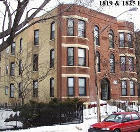 Minneapolis apartment for rent - A red car is parked in front of a large brick building.