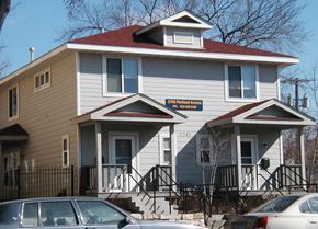 Minneapolis apartment for rent - A two story house with a car parked in front.