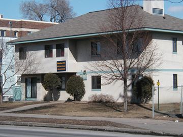 Minneapolis apartment for rent - a white house with a sign on the side of it
