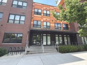 Minneapolis apartment for rent - The image shows a building with a glass entrance and a sign that reads "LOVE".