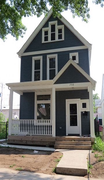 St. Paul apartment for rent - A blue house with white trim and a porch.