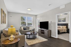 Traverse City apartment for rent - A living room with a couch, chair, and coffee table.