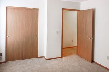 Upper Sandusky apartment for rent - a bedroom with two doors and a carpeted floor