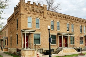 Columbus apartment for rent - an old brick building with red doors and windows