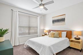 Plano apartment for rent - a bedroom with a bed and a ceiling fan at Mission Gate, Plano, 75024